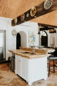 farmhouse sink with white cabinets