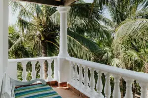 a balcony of a villa with a sofa