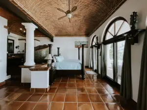 villa bedroom with two large windows