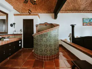 a bathroom with two sinks and a center shower