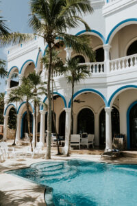 swimming pool and trees outside a villa