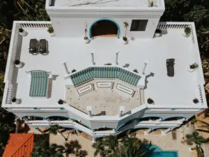 terrace of a beach villa with chairs and plants