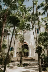 side view of a villa covered by trees